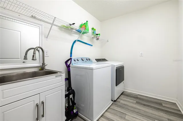 a view of a swimming pool with a table and chairs