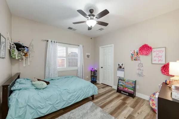 a bed room with a bed and a television