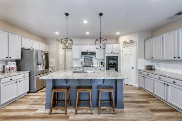 a view of a dining room with furniture and window