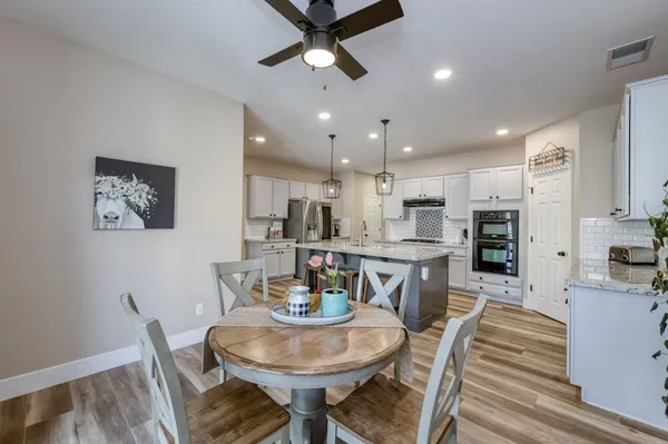 a kitchen with a sink a stove and refrigerator