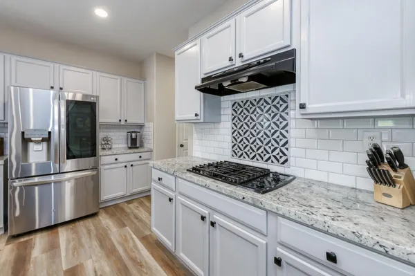 a bedroom with a bed dresser and a window