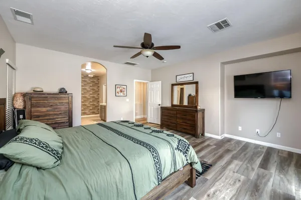 a bathroom with a shower a bath tub and shower
