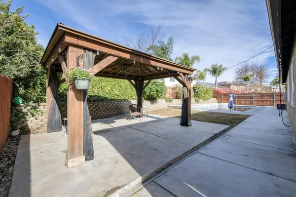 a view of a yard with patio