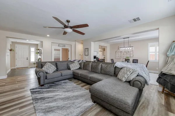 a view of a dining room with furniture window and wooden floor