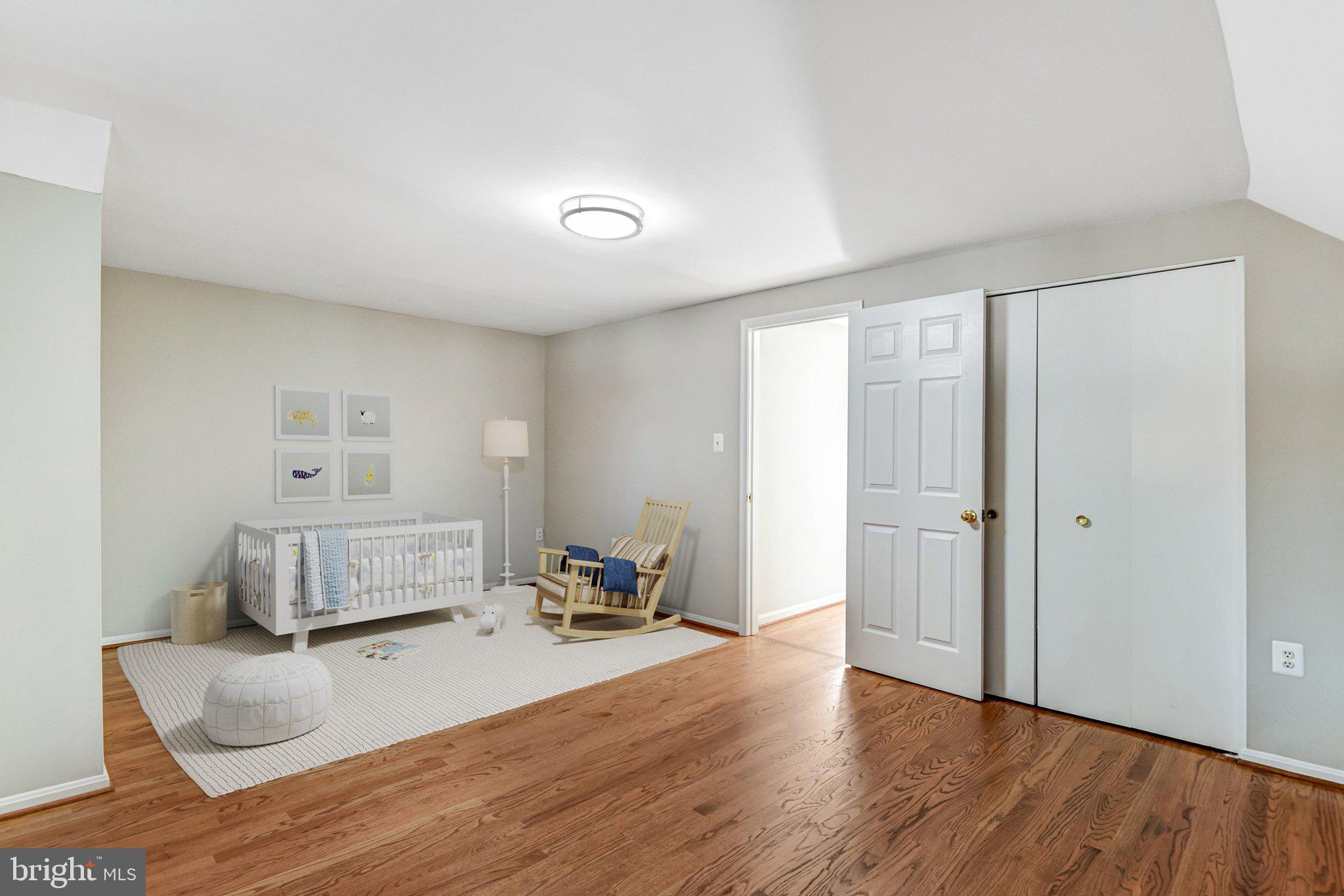 9720 Five Oaks Road Fairfax, VA 22031 - Photo 15 of 91 a bedroom with a bed and wooden floor
