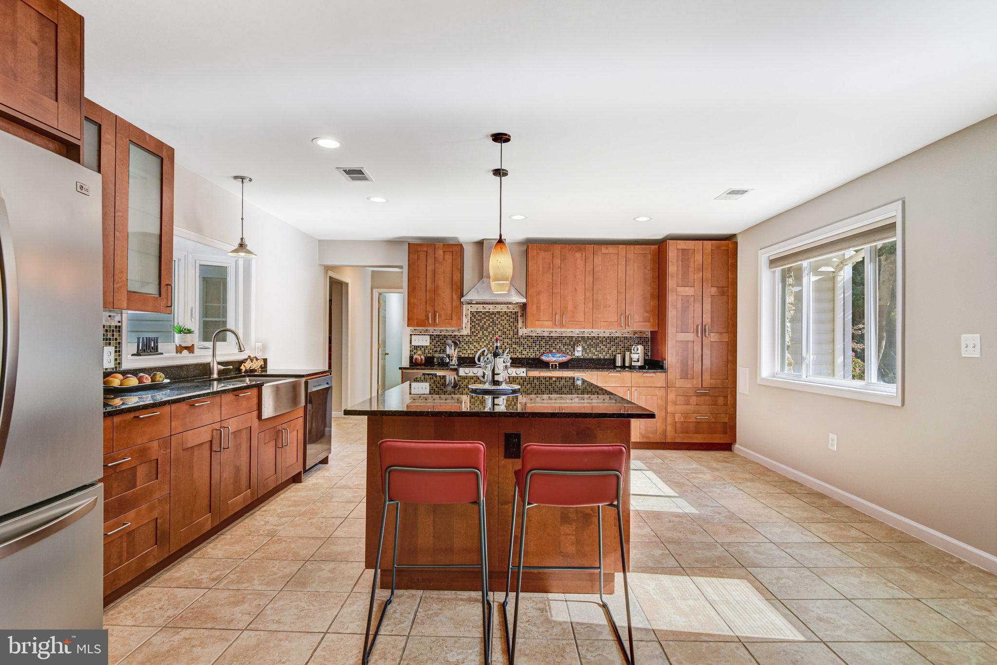 9720 Five Oaks Road Fairfax, VA 22031 - Photo 18 of 91 a kitchen with stainless steel appliances granite countertop a stove top oven a sink dishwasher and a refrigerator
