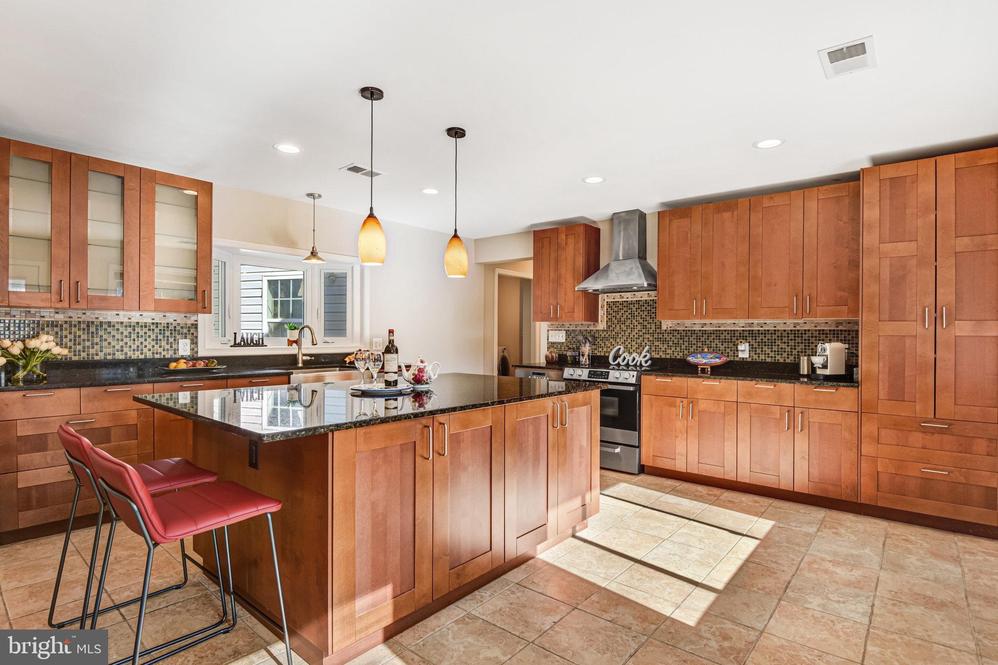 9720 Five Oaks Road Fairfax, VA 22031 - Photo 22 of 91 a kitchen with stainless steel appliances granite countertop a stove a sink and a refrigerator