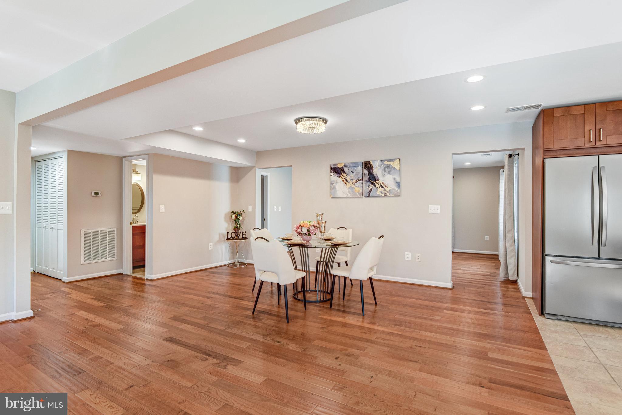 9720 Five Oaks Road Fairfax, VA 22031 - Photo 91 of 91 a view of a dining room with furniture and wooden floor