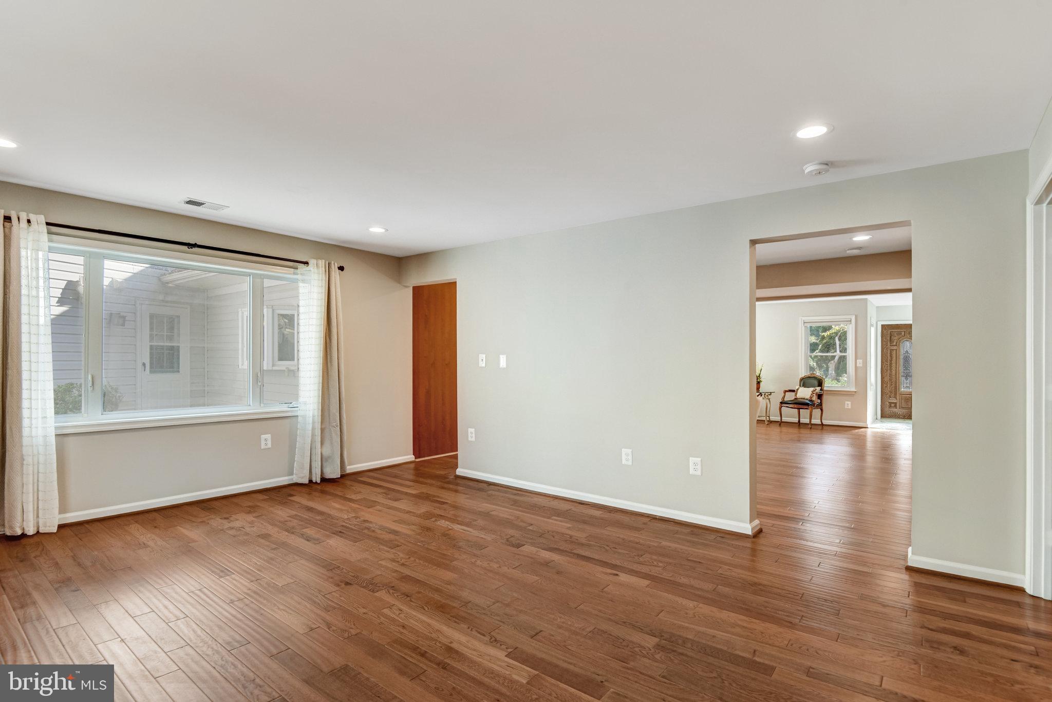 9720 Five Oaks Road Fairfax, VA 22031 - Photo 33 of 91 a view of empty room with wooden floor and fan