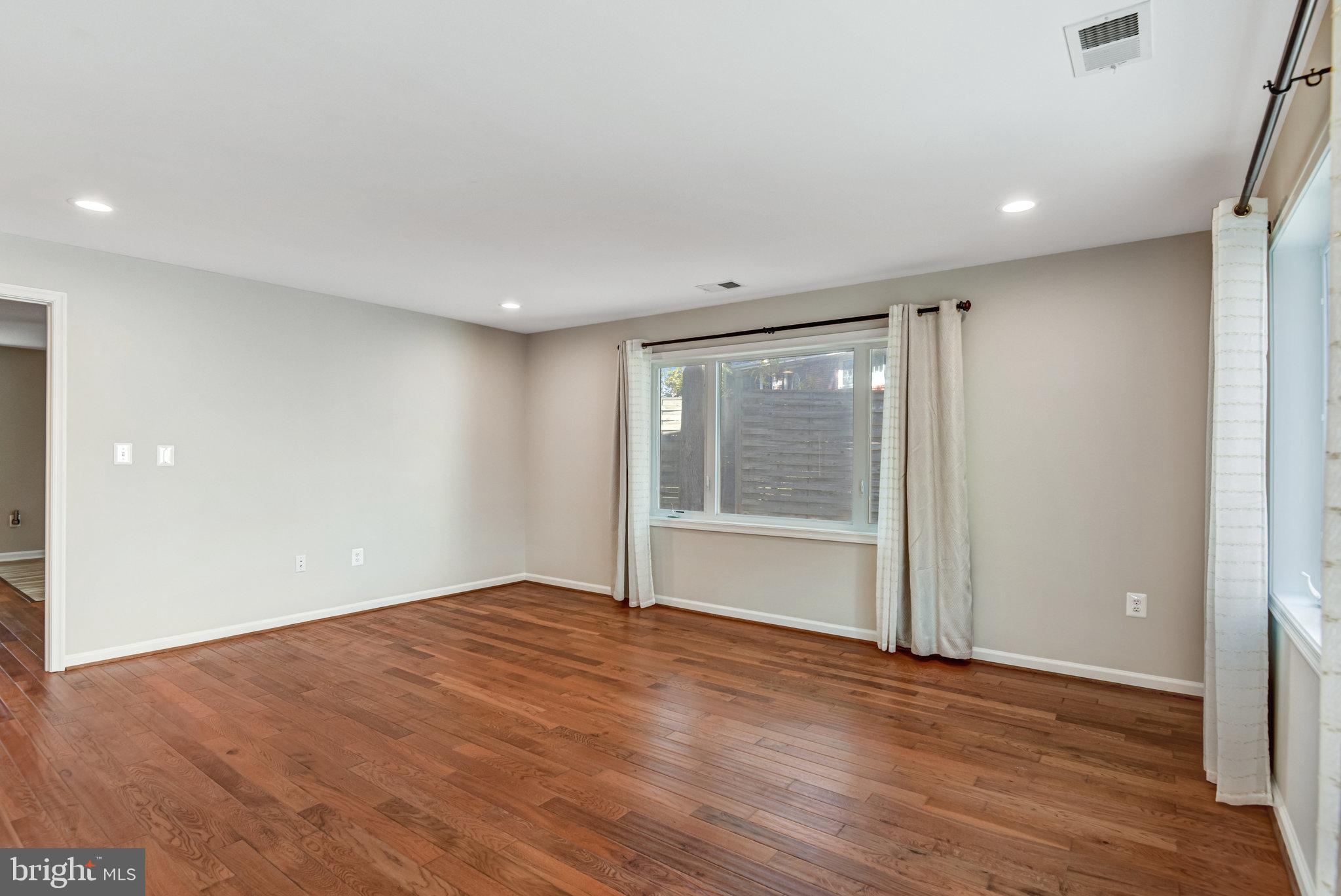 9720 Five Oaks Road Fairfax, VA 22031 - Photo 34 of 91 a view of empty room with wooden floor and fan