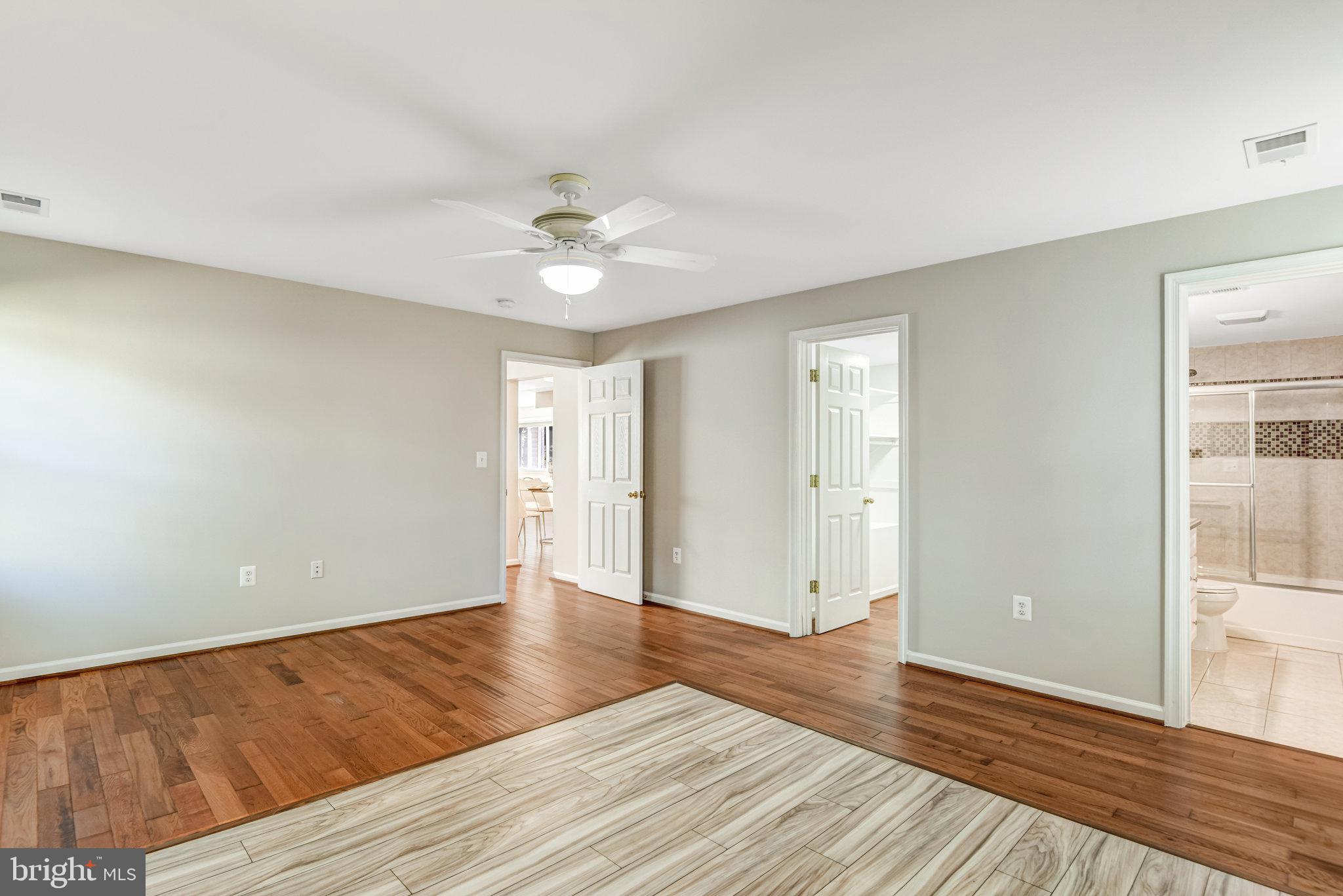 9720 Five Oaks Road Fairfax, VA 22031 - Photo 37 of 91 a view of an empty room with wooden floor