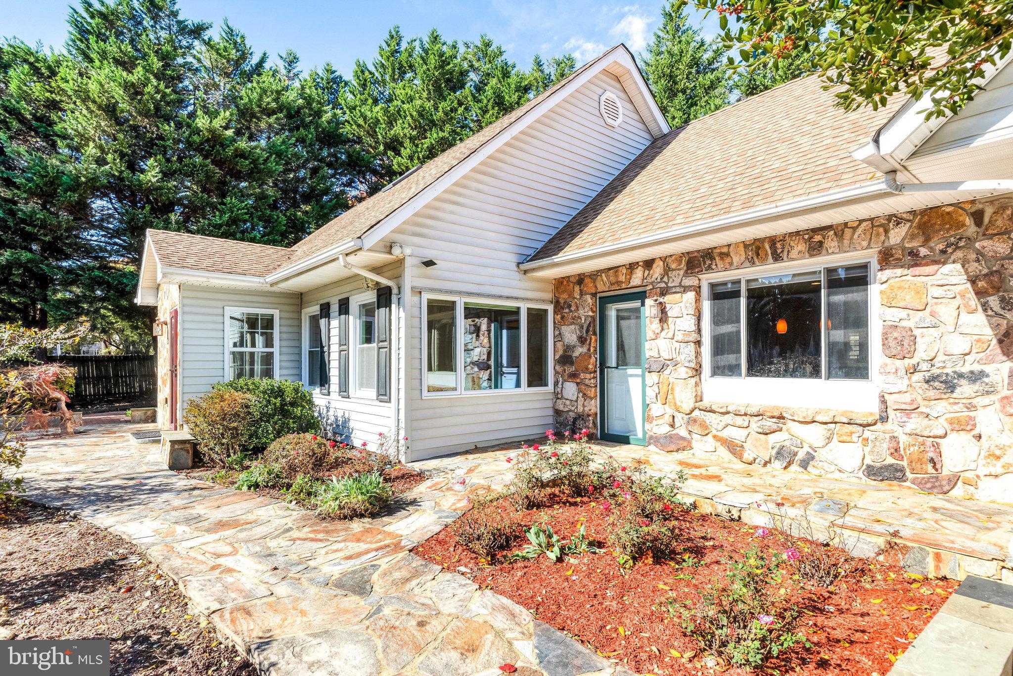 9720 Five Oaks Road Fairfax, VA 22031 - Photo 5 of 91 a front view of a house with a yard outdoor space and garden