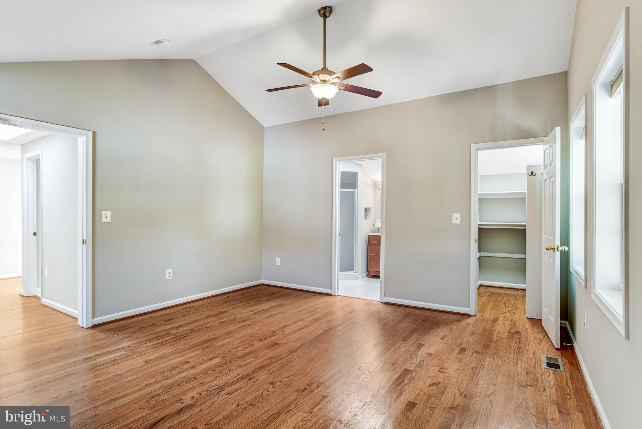 9720 Five Oaks Road Fairfax, VA 22031 - Photo 52 of 91 a view of a room with wooden floor and ceiling fan
