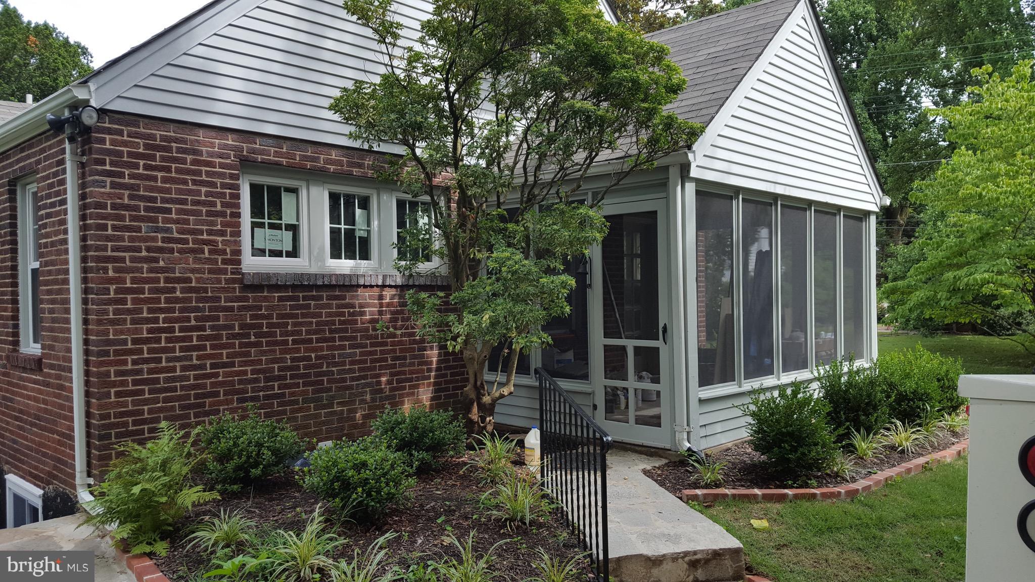 5 Melbourne Avenue Silver Spring, MD 20901 - Photo 22 of 25 a view of a house with a yard and potted plants
