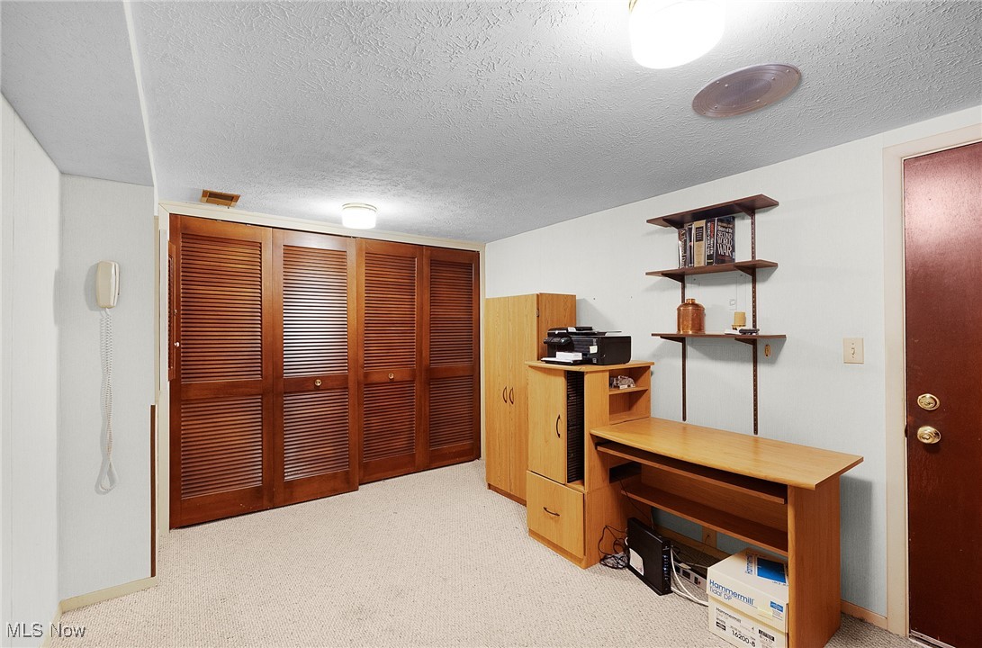 6474 State Road, Unit I10 Parma, OH 44134 - Photo 27 of 31 Unfurnished office featuring a textured ceiling and light colored carpet