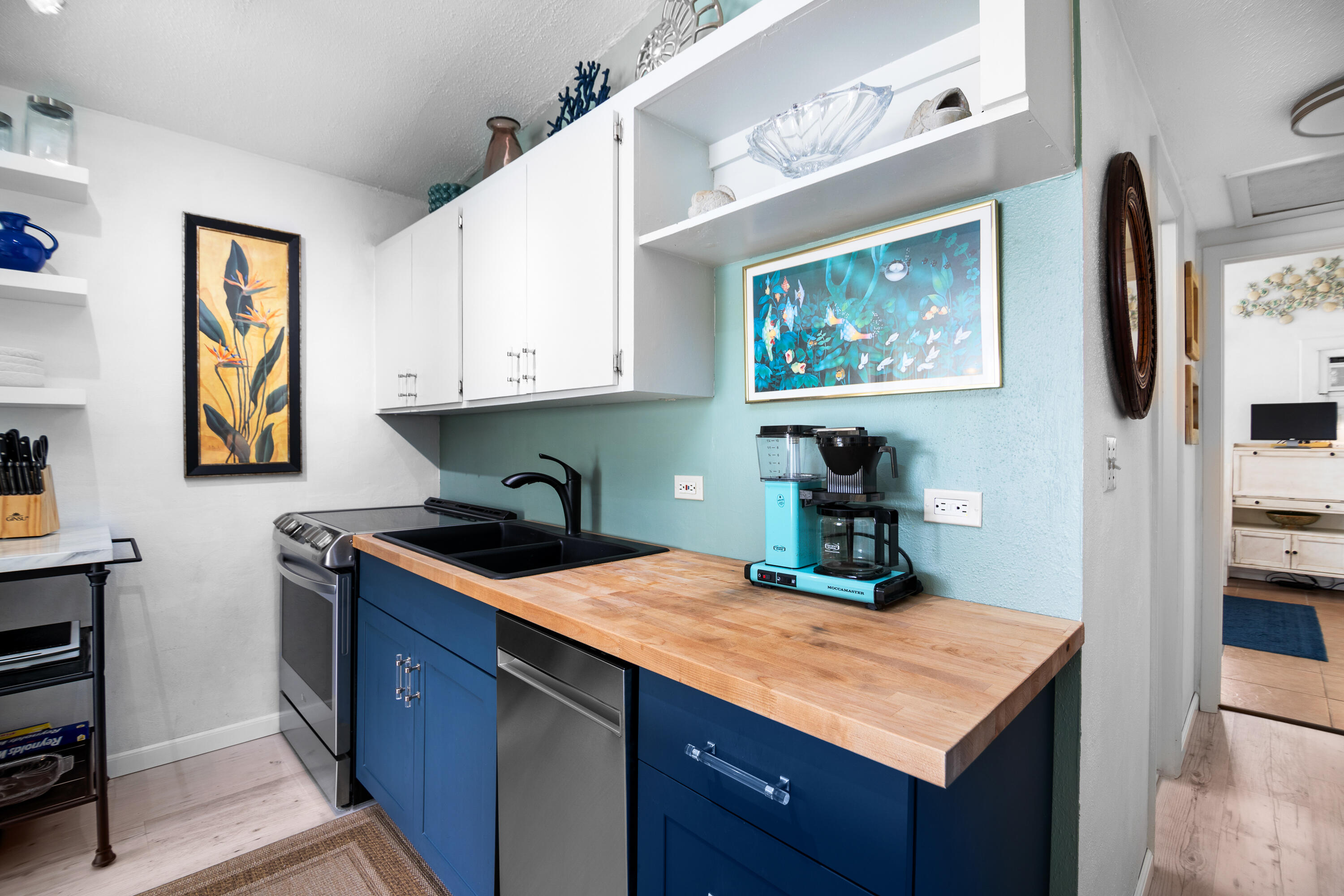 10 Clara Boulevard Marathon, FL 33051 - Photo 11 of 39 a kitchen with kitchen island granite countertop a sink cabinets and stainless steel appliances