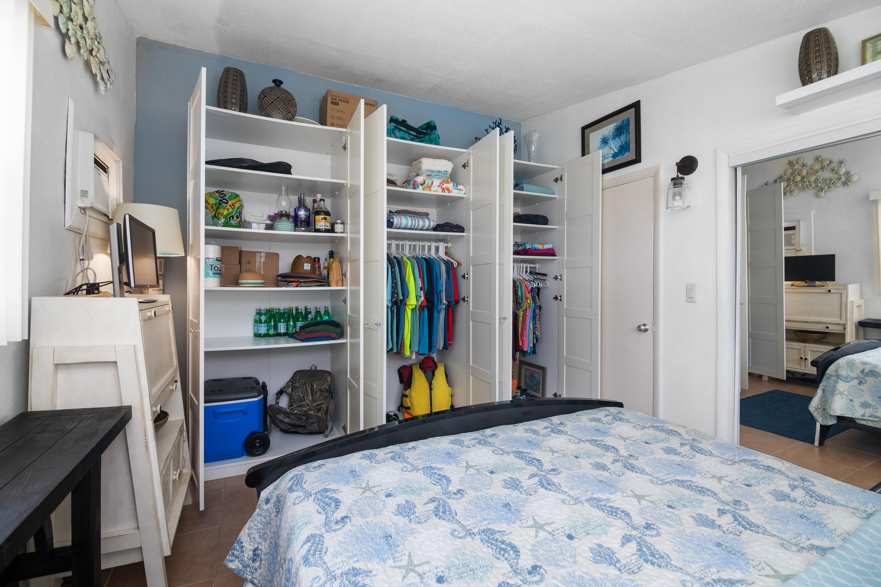 10 Clara Boulevard Marathon, FL 33051 - Photo 15 of 39 a bedroom with a bed and a book shelf