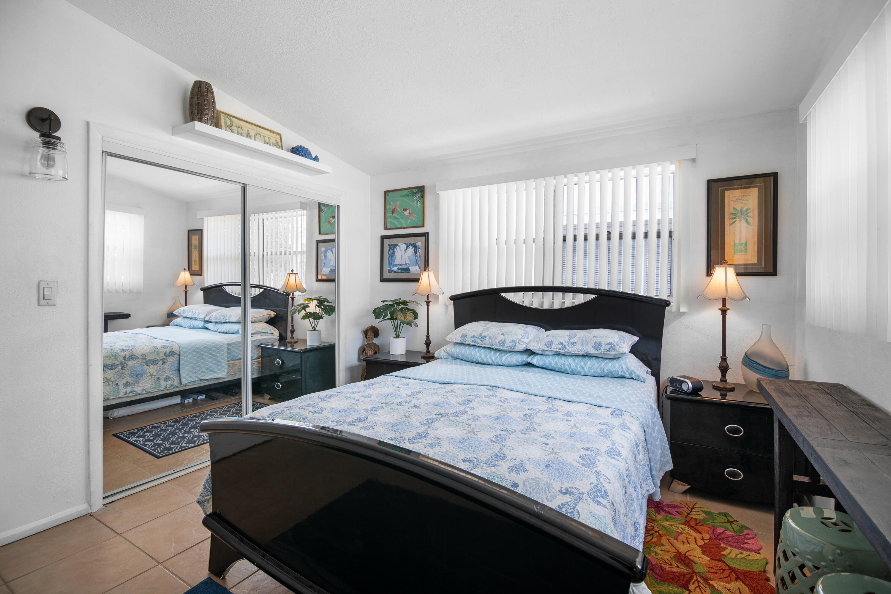 10 Clara Boulevard Marathon, FL 33051 - Photo 16 of 39 a bedroom with a bed and wooden floor