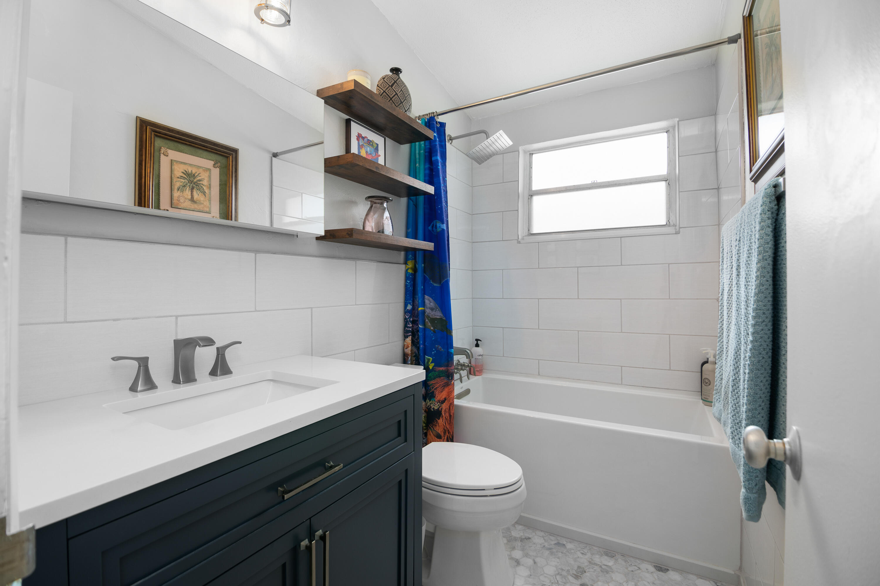10 Clara Boulevard Marathon, FL 33051 - Photo 18 of 39 a bathroom with a sink a toilet and shower