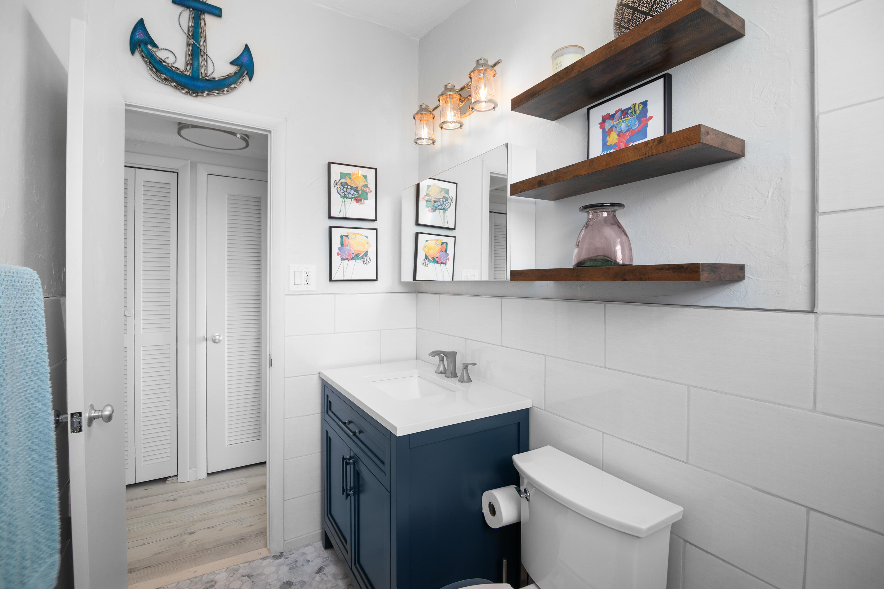 10 Clara Boulevard Marathon, FL 33051 - Photo 19 of 39 a bathroom with a toilet sink and mirror