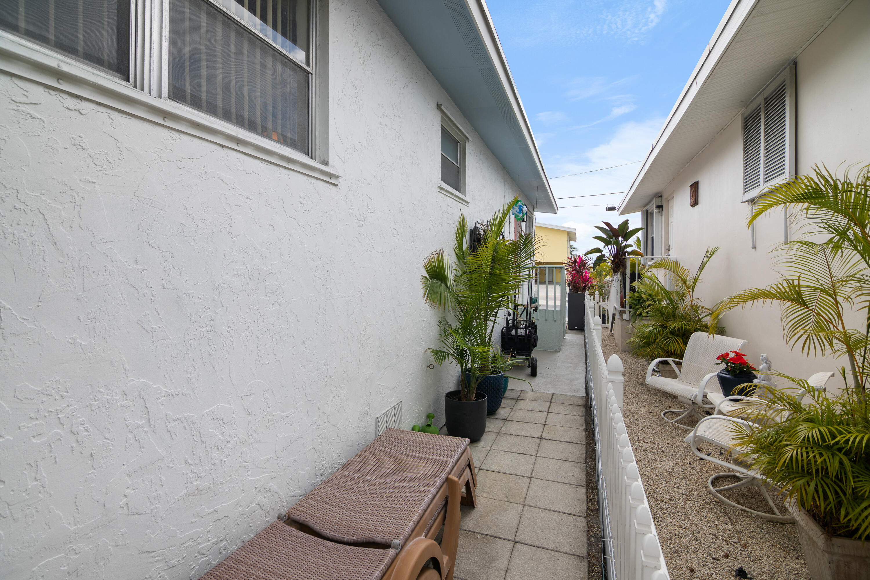 10 Clara Boulevard Marathon, FL 33051 - Photo 26 of 39 a potted plant sitting in front of a door