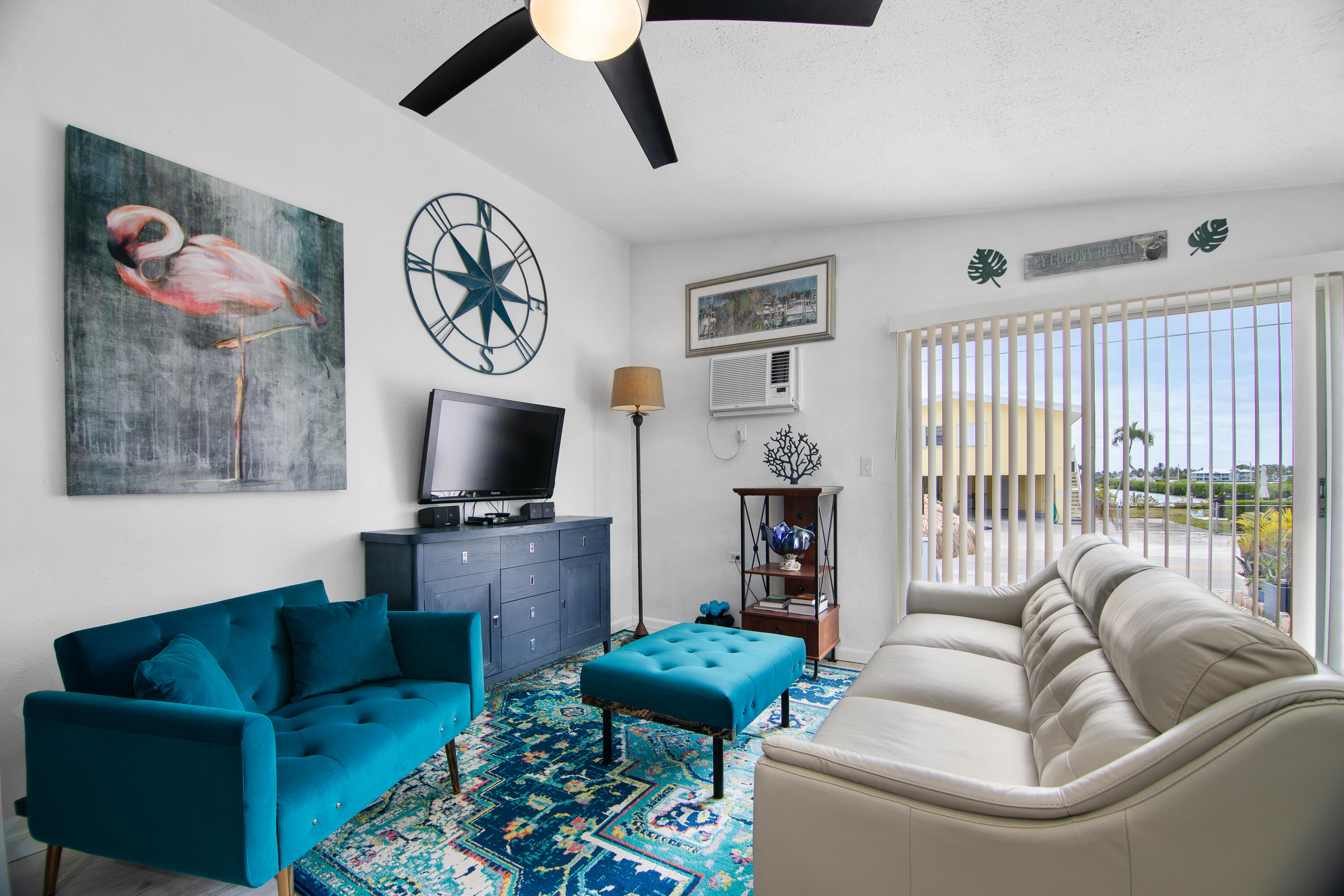 10 Clara Boulevard Marathon, FL 33051 - Photo 3 of 39 a living room with furniture and a flat screen tv