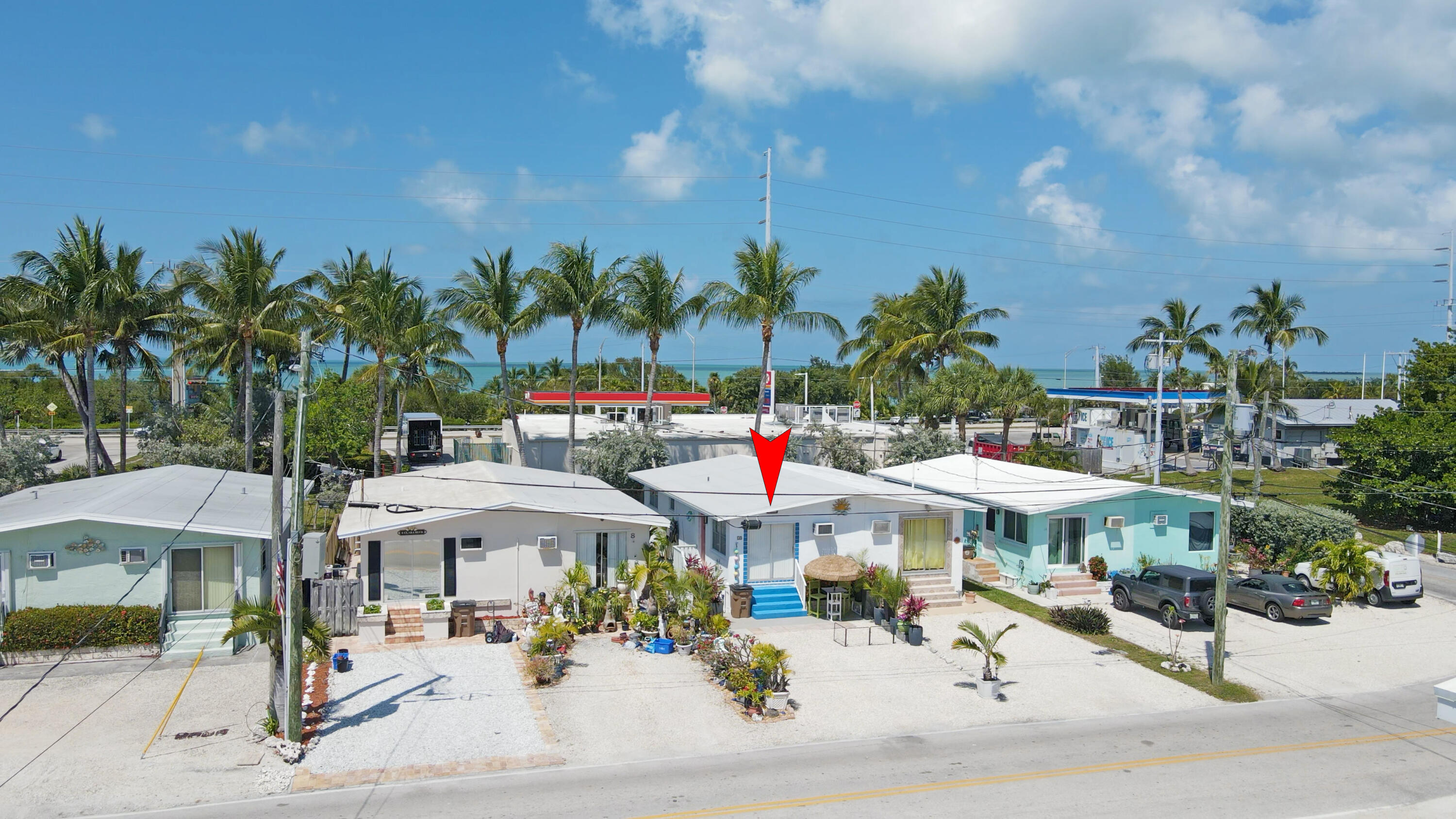10 Clara Boulevard Marathon, FL 33051 - Photo 33 of 39 a group of lawn chairs under an umbrella