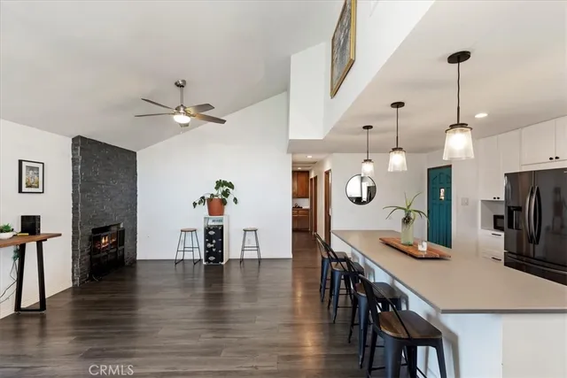 a kitchen with stainless steel appliances a sink stove and refrigerator