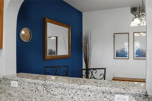 a view of kitchen with furniture and wooden floor