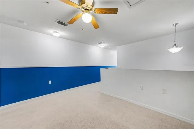 an aerial view of residential houses with outdoor space and lake view
