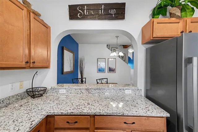 a view of a livingroom with a chandelier furniture and entryway