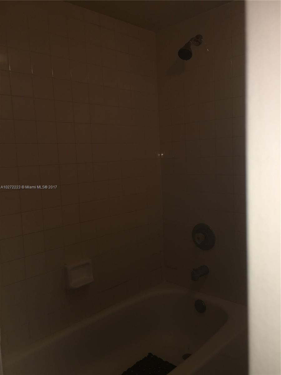 1071 Adams Avenue, Unit 1071F Homestead, FL 33034 - Photo 16 of 18 a close up of a shower