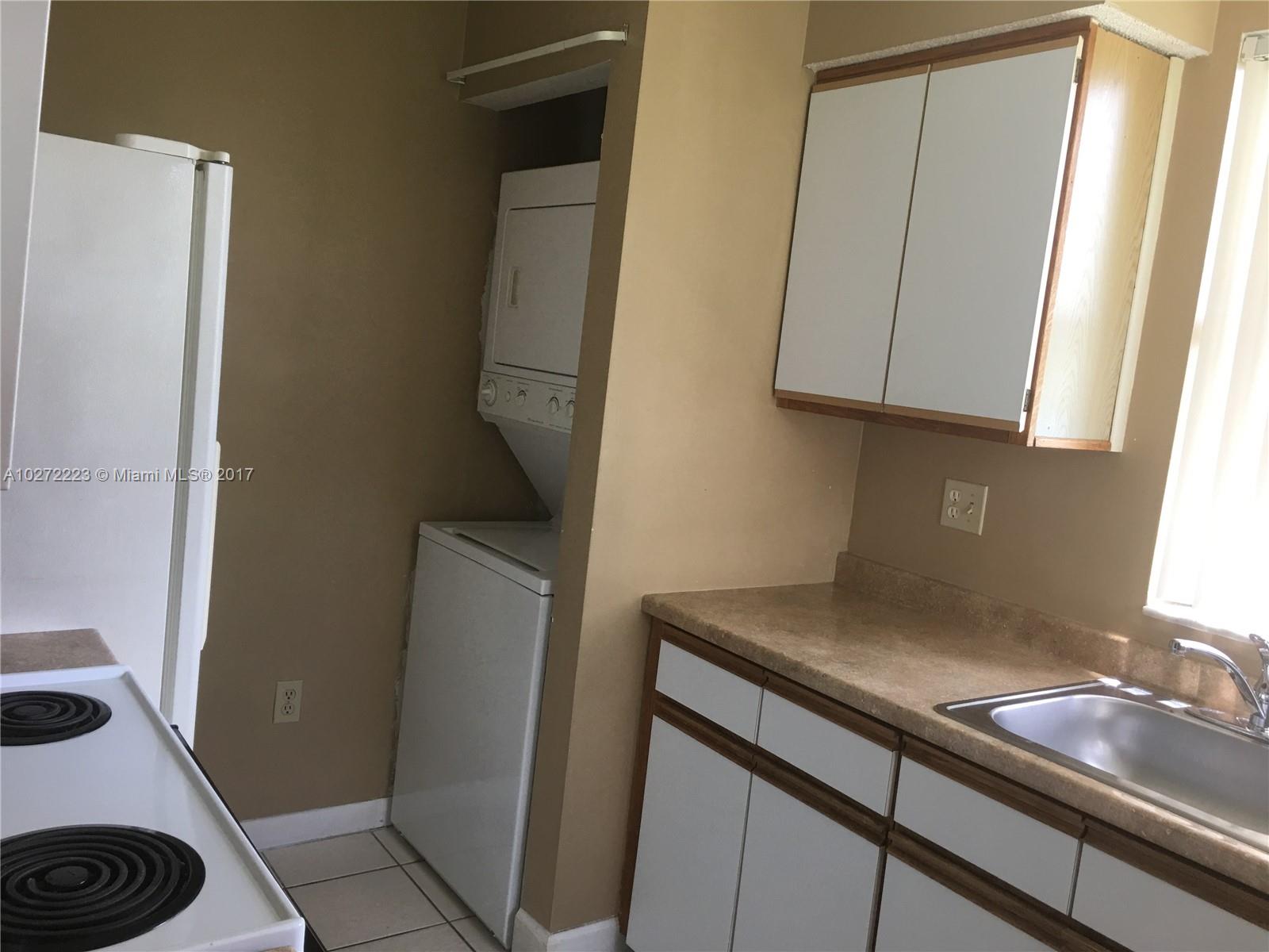 1071 Adams Avenue, Unit 1071F Homestead, FL 33034 - Photo 5 of 18 a bathroom with a sink and a vanity