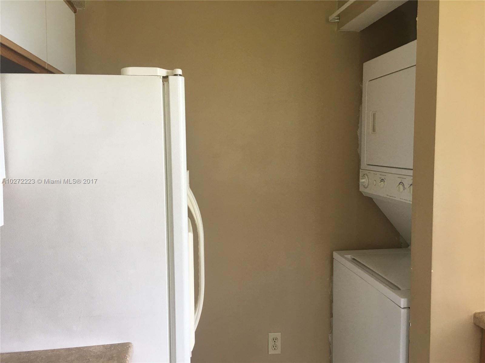 1071 Adams Avenue, Unit 1071F Homestead, FL 33034 - Photo 6 of 18 a utility room with dryer and washer