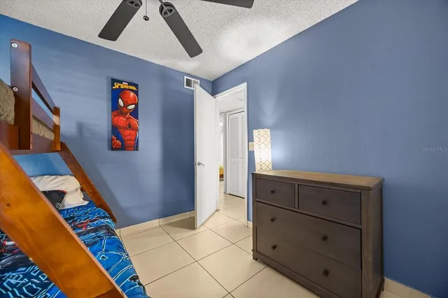 a bedroom with a bed and a cabinets