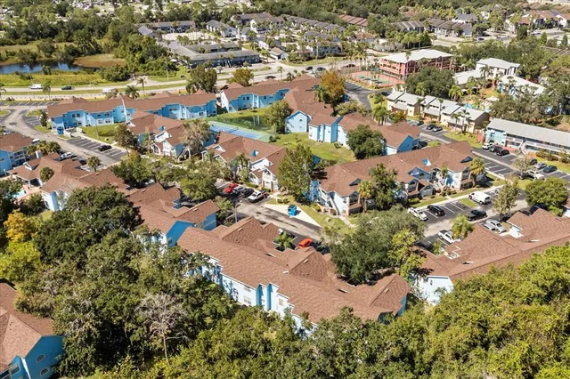 an aerial view of a house with yard