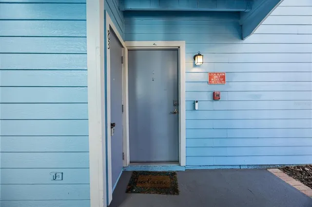 a living room with furniture chandelier and a chandelier