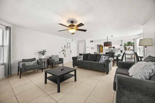 a dining room with furniture a window and kitchen view
