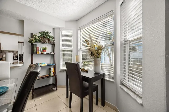 a kitchen with stainless steel appliances granite countertop a sink and a refrigerator