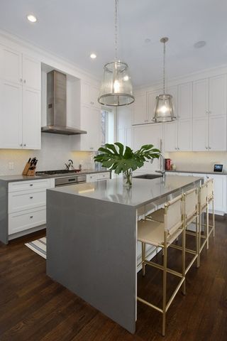 a kitchen with stainless steel appliances granite countertop a sink and a stove