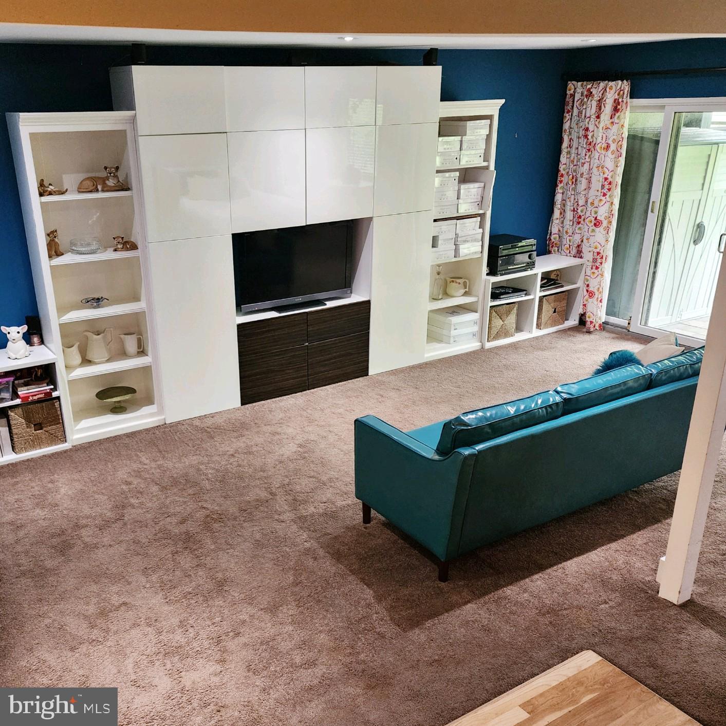 11610 Newbridge Court Reston, VA 20191 - Photo 13 of 21 Basement media wall unit conveys