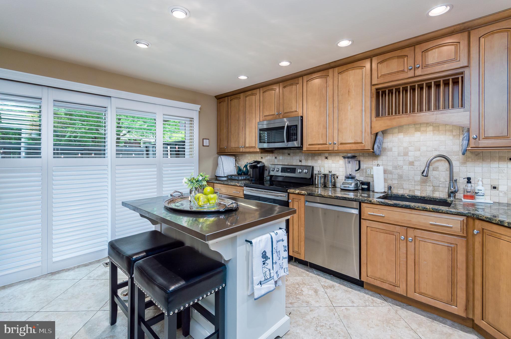 11610 Newbridge Court Reston, VA 20191 - Photo 6 of 21 Wood plantation shutters convey