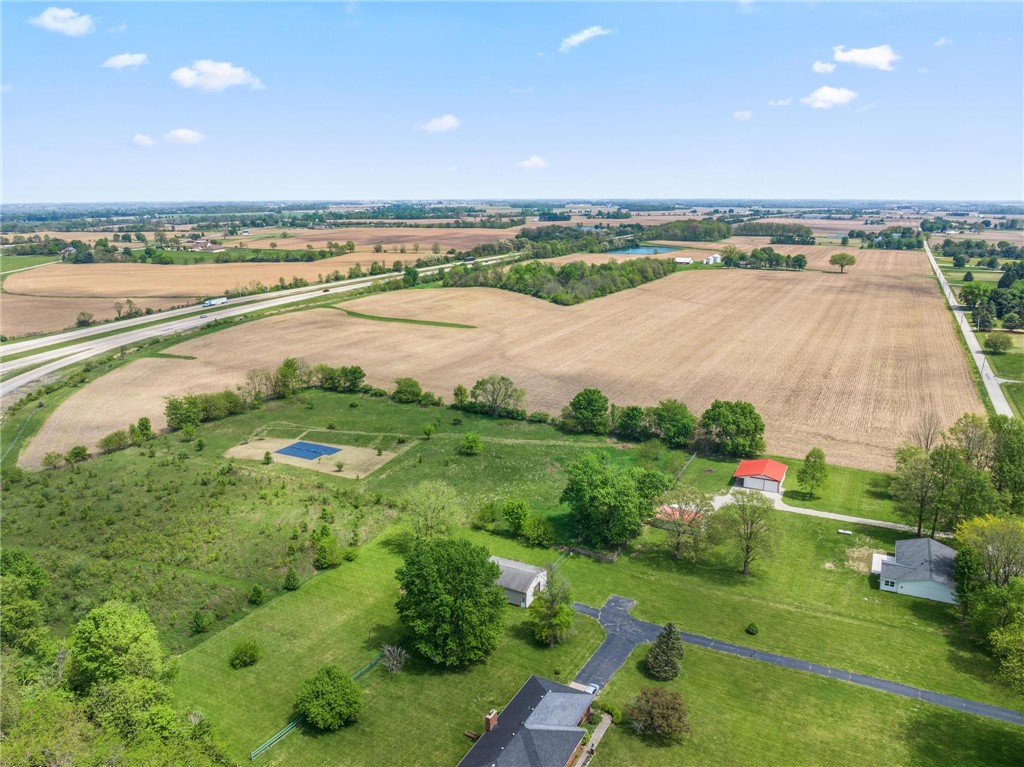 1353 Foust Road Xenia, OH 45385 - Photo 6 of 50 This sprawling estate features verdant fields, a serene pond, and abundant open space.
