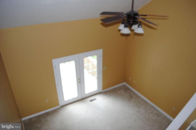 440 Ford Circle Inwood, WV 25428 - Photo 2 of 8 an empty room with a window