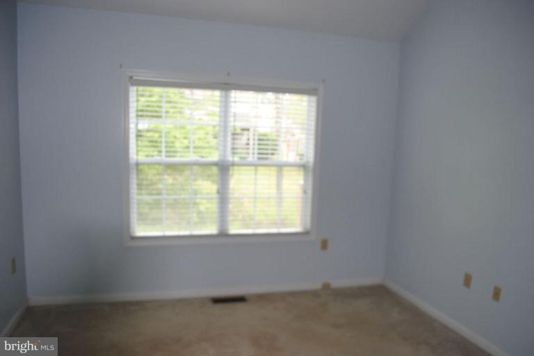 440 Ford Circle Inwood, WV 25428 - Photo 4 of 8 an empty room with a window