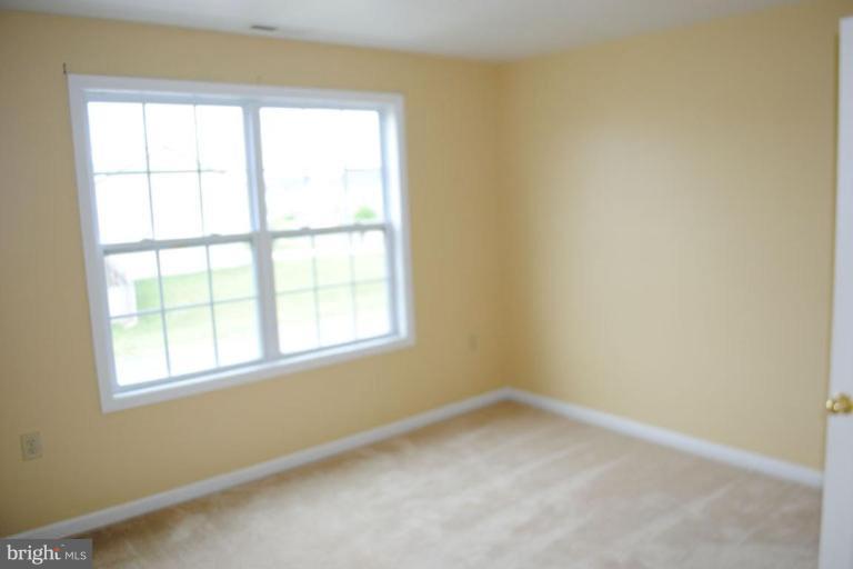440 Ford Circle Inwood, WV 25428 - Photo 6 of 8 an empty room with a window