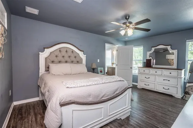 a bedroom with a bed and a dresser
