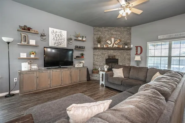a living room with furniture and a flat screen tv