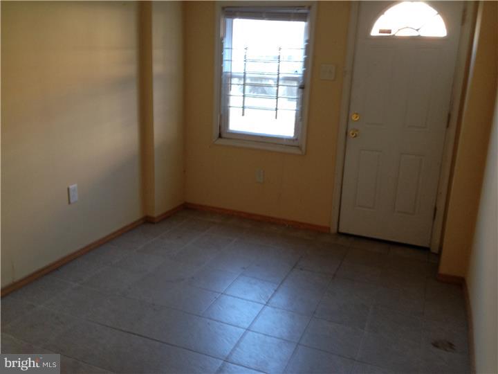 6316 Jackson Street Philadelphia, PA 19135 - Photo 13 of 14 an empty room with windows
