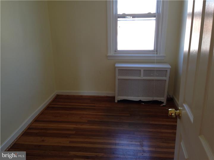 6316 Jackson Street Philadelphia, PA 19135 - Photo 9 of 14 a room with a hardwood